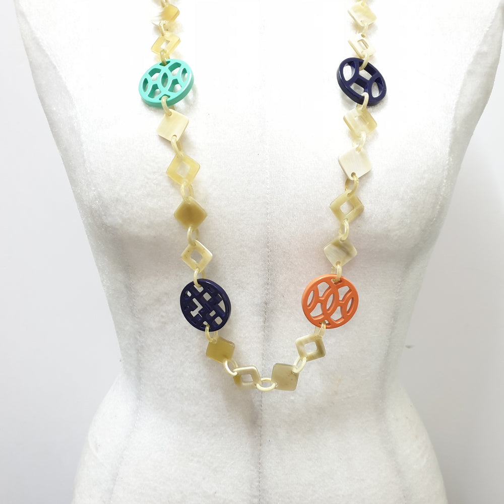 
                  
                    This necklace have several pieces with different patterns and colors on the light background, unique gift for your friend
                  
                