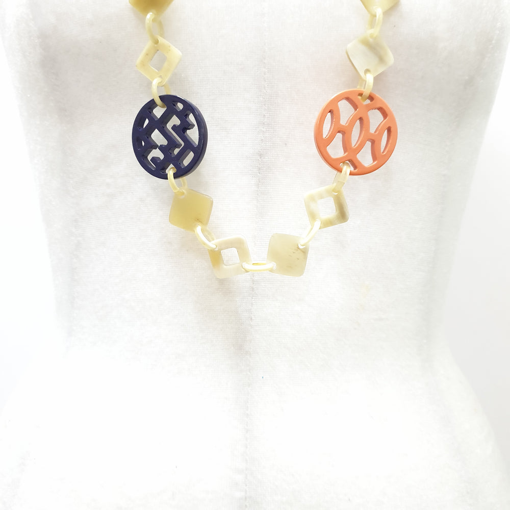 
                  
                    This necklace have several pieces with different patterns and colors on the light background, unique gift for your friend
                  
                