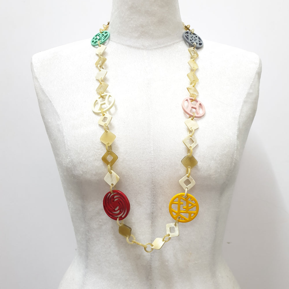 
                  
                    This necklace have several pieces with different patterns and colors on the light background, unique gift for your friend
                  
                