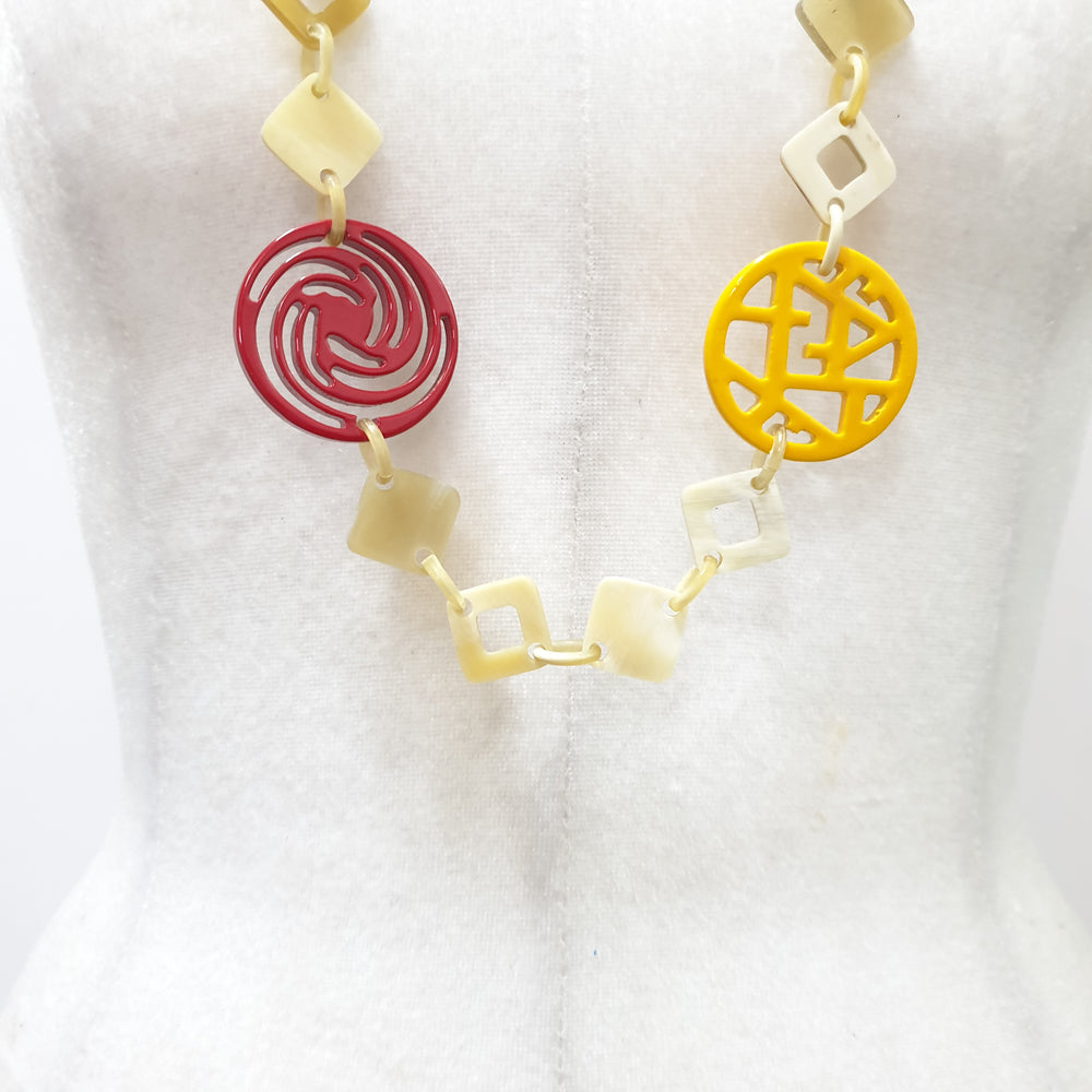 
                  
                    This necklace have several pieces with different patterns and colors on the light background, unique gift for your friend
                  
                