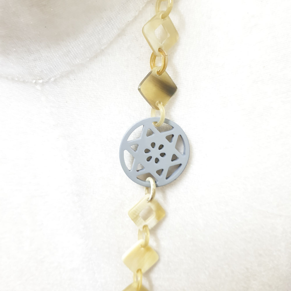 
                  
                    This necklace have several pieces with different patterns and colors on the light background, unique gift for your friend
                  
                
