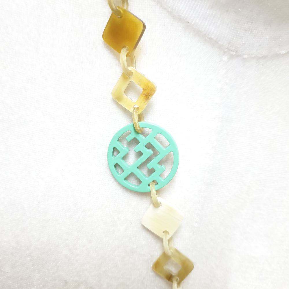 
                  
                    This necklace have several pieces with different patterns and colors on the light background, unique gift for your friend
                  
                