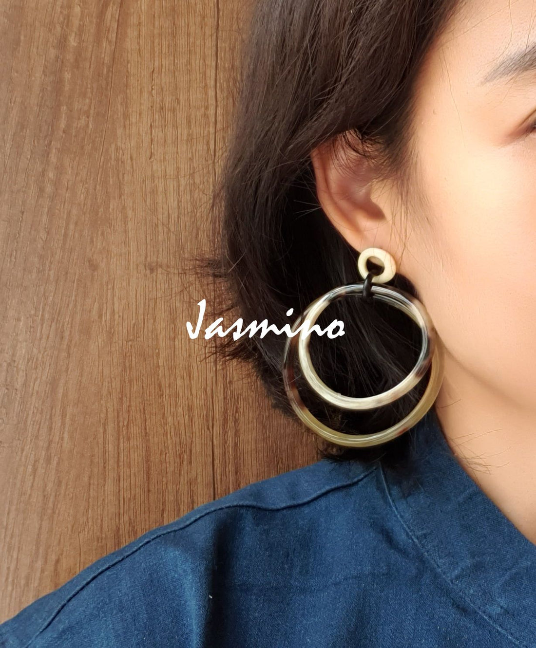 Handmade double circle drop earrings feature the color of leopard skin and natural buffalo horn in the natural light
