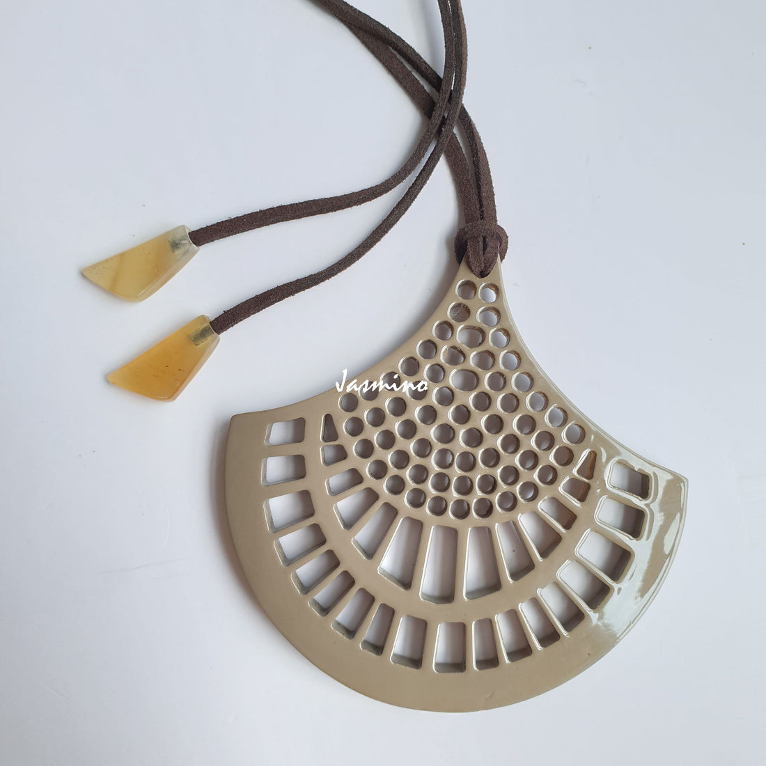 Vintage unique handmade pendant features a beige colour made of natural buffalo horn for women