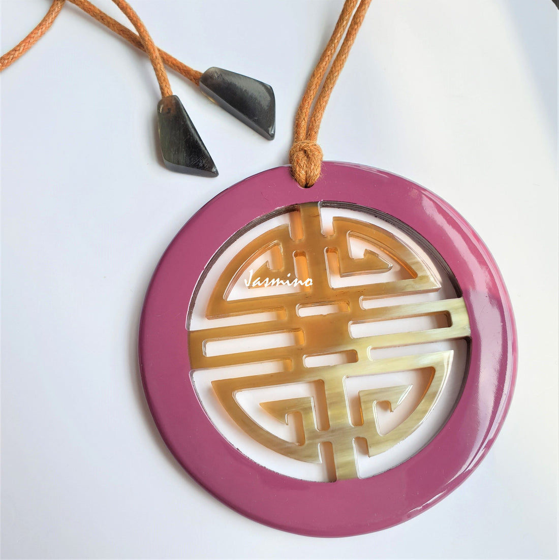 Unique Vintage Asian circle pendant features a circle shape and pink colour that is made of natural buffalo horn
