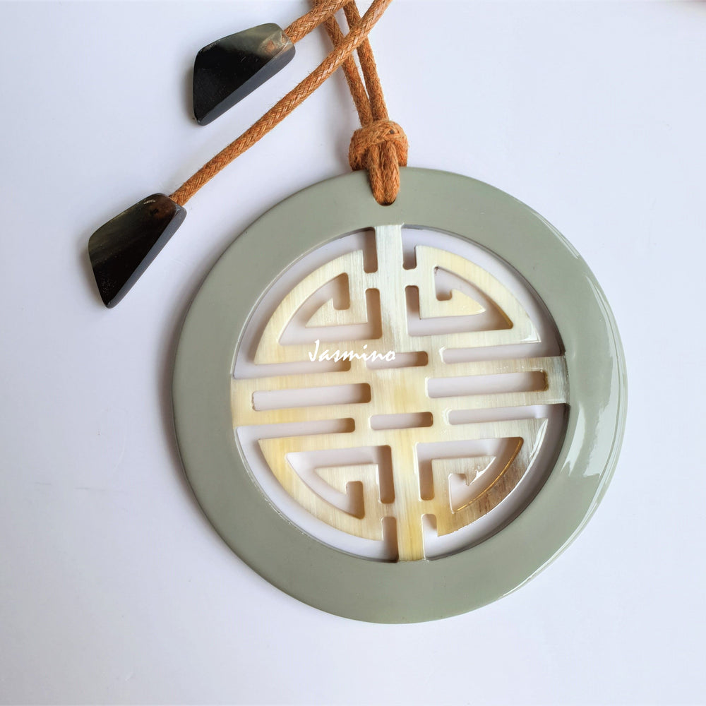 
                  
                    Unique Vintage Asian circle pendant features a circle shape and greyish green colour that is made of natural buffalo horn
                  
                