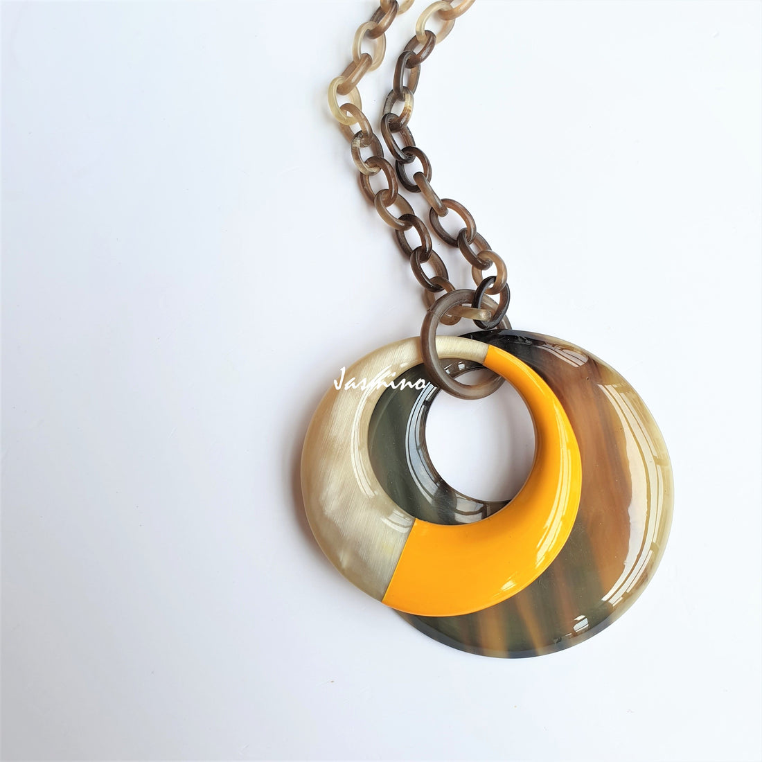 Unique handmade double circle pendant features brown and yellow made of natural buffalo horn