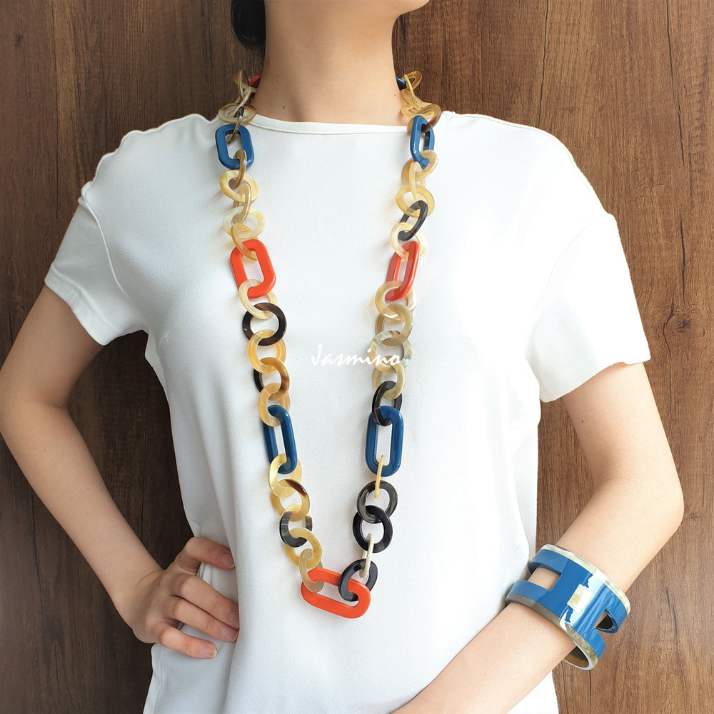 
                  
                    A model is wearing unique handmade Vintage H shaped cuff bracelet features brown and navy in natural buffalo horn for women
                  
                