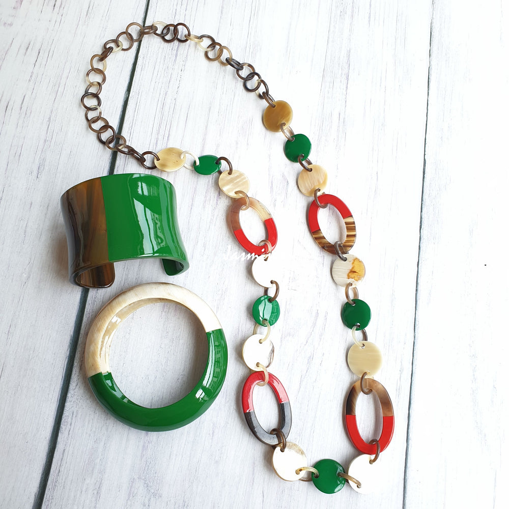 
                  
                    A set of Jasmino unique handmade chain link necklace and bracelets featured brown, green, and orange in natural buffalo horn for women
                  
                