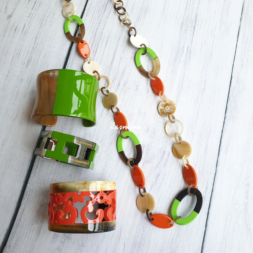 
                  
                    A set of Jasmino unique handmade chain link necklace and bracelets featured brown, green, and orange in natural buffalo horn for women
                  
                