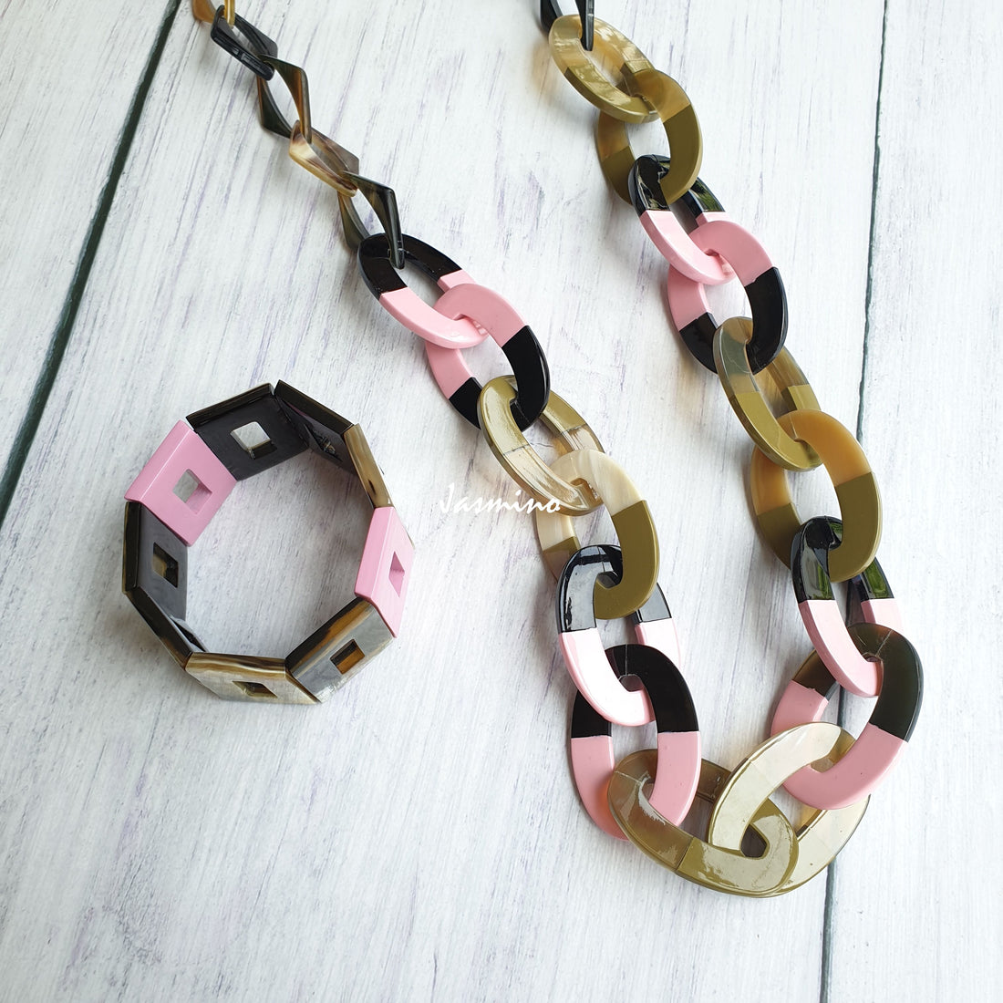 A set of Jasmino unique handmade Bohemian Vintage chain necklace and bangle bracelet featured black and pink in natural buffalo horn for women's gifts
