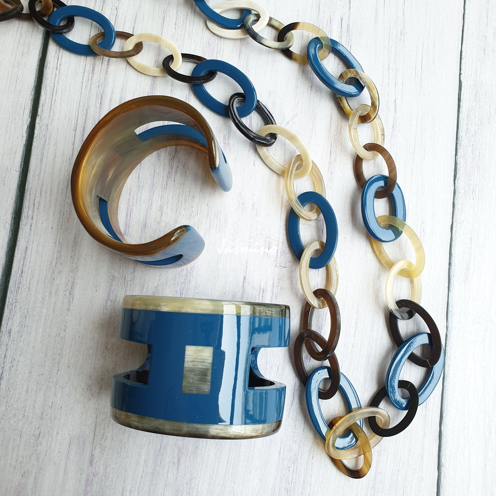 
                  
                    A set of unique handmade Vintage chain necklace and cuff bracelets feature blue and brown in natural buffalo horn for women
                  
                