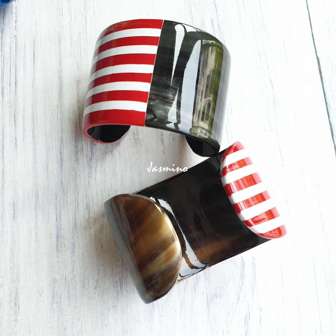 Two Jasmino unique handmade USA flag patriot cuff bracelets in natural buffalo horn for men and women