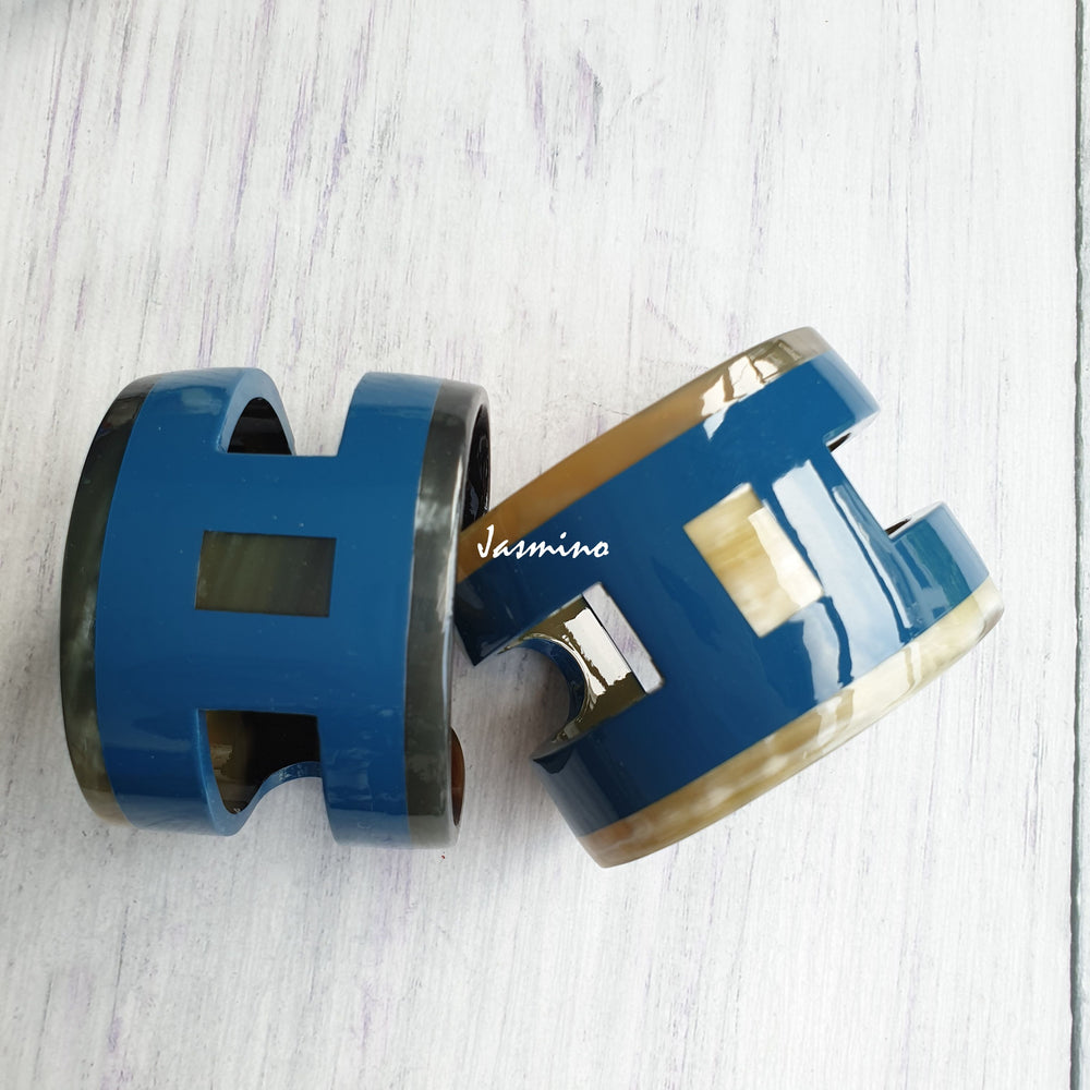 
                  
                    Two Unique handmade Vintage H shaped cuff bracelets feature brown and navy in natural buffalo horn for women
                  
                