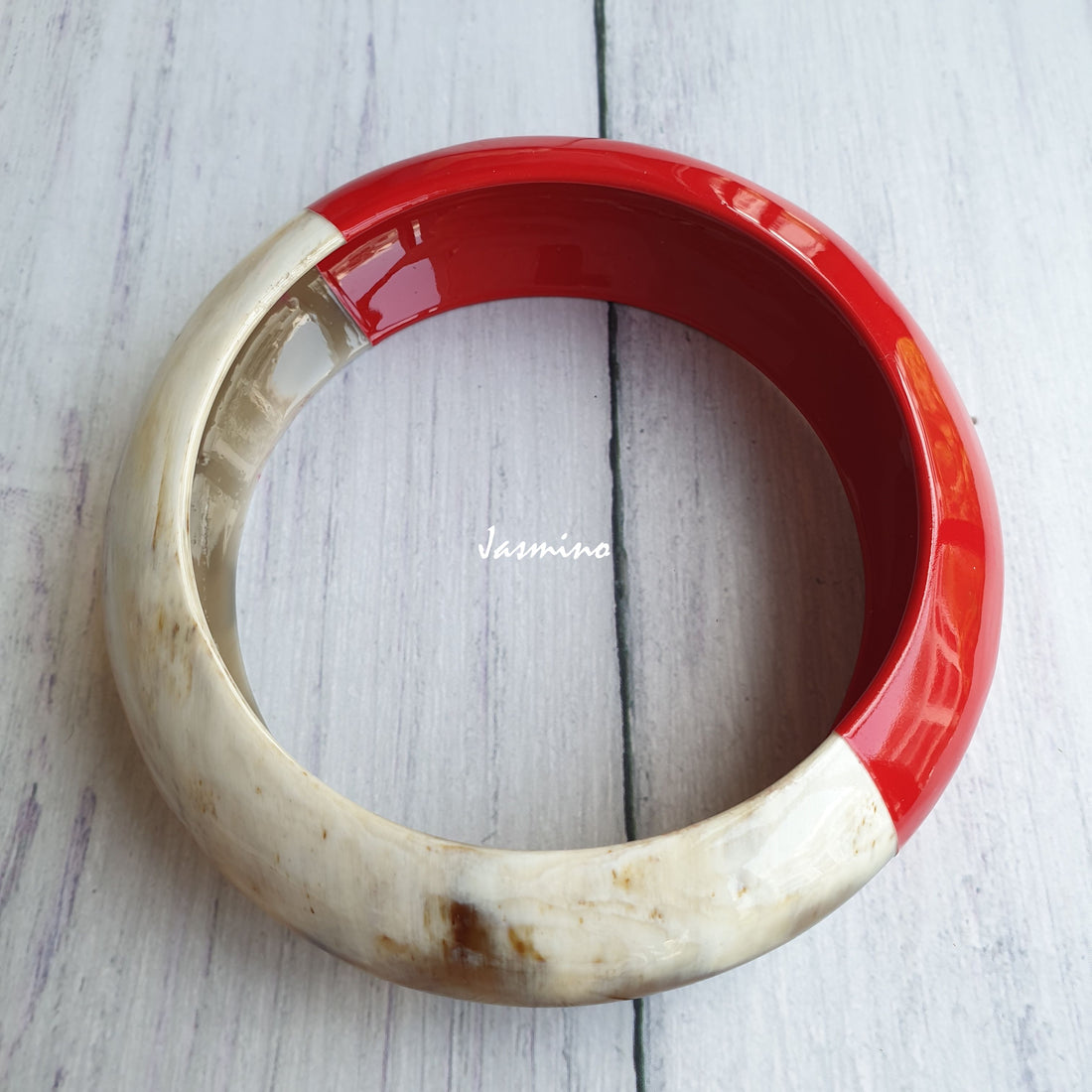 Jasmino unique handmade bangle bracelet is detailed by a red half and a white half in natural buffalo horn for Christmas gifts
