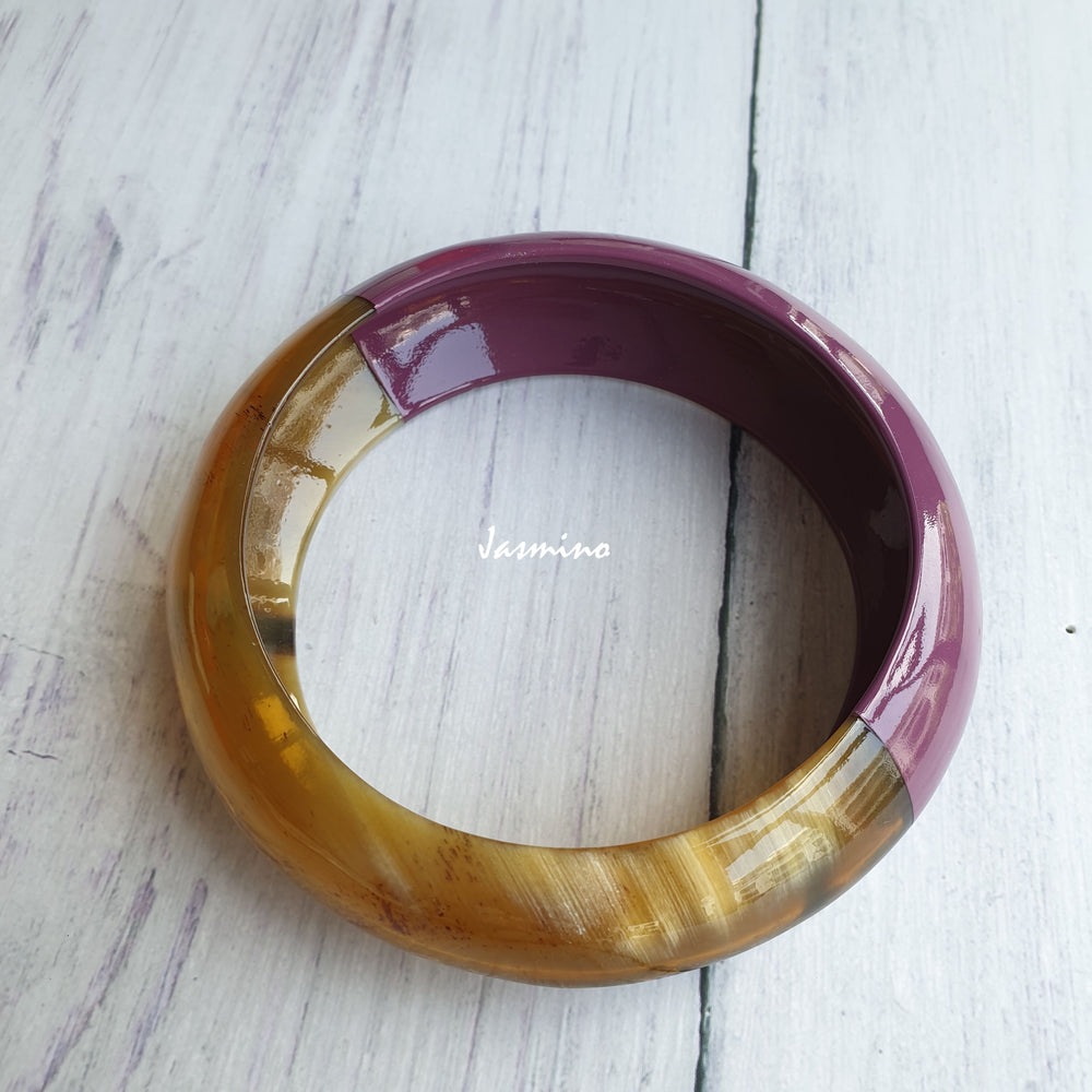 
                  
                    Jasmino unique handmade bangle bracelet is detailed by a purple half and a white half in natural buffalo horn for Christmas gifts
                  
                