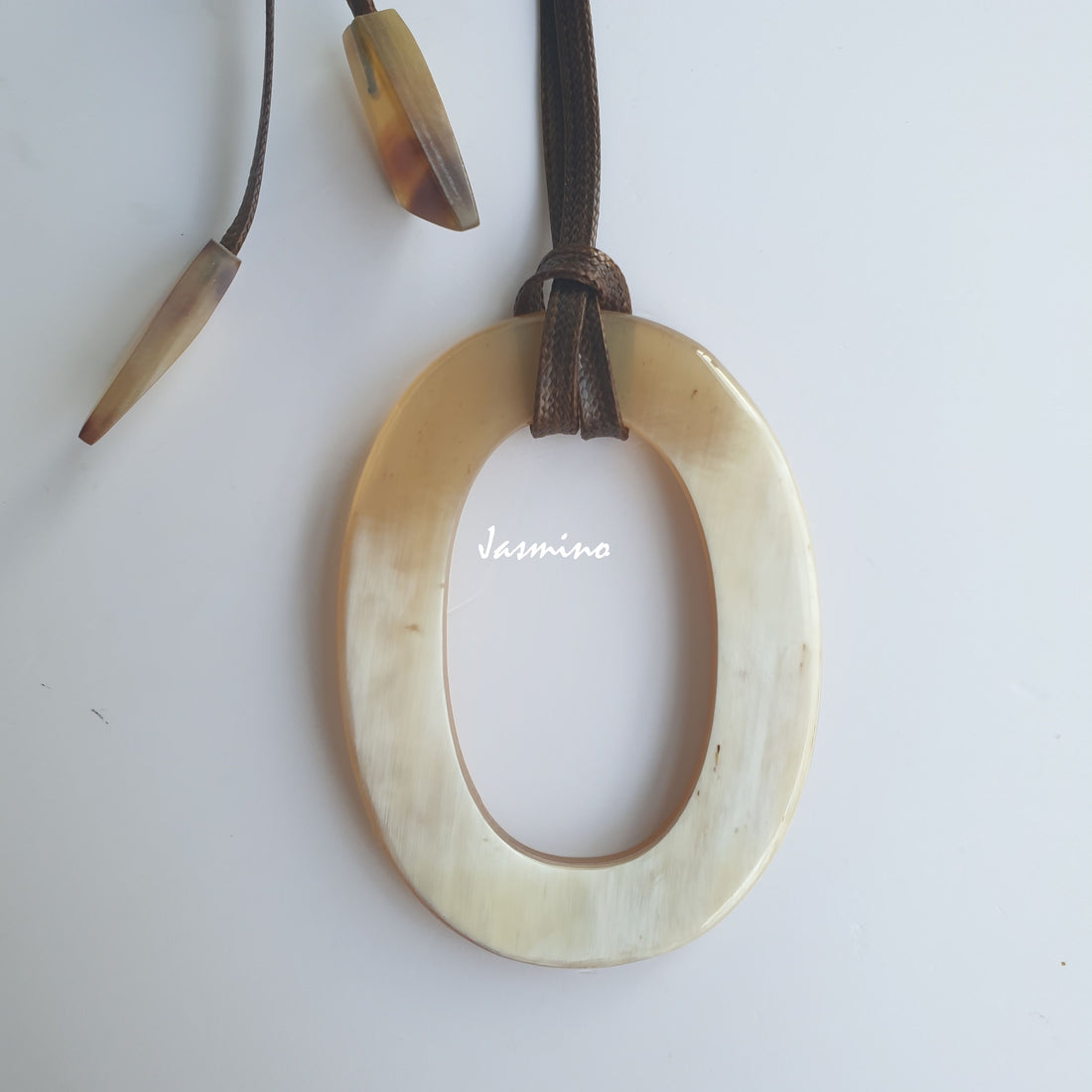 Unique handmade Vintage large oval pendant features a white colour that is made of natural buffalo horn
