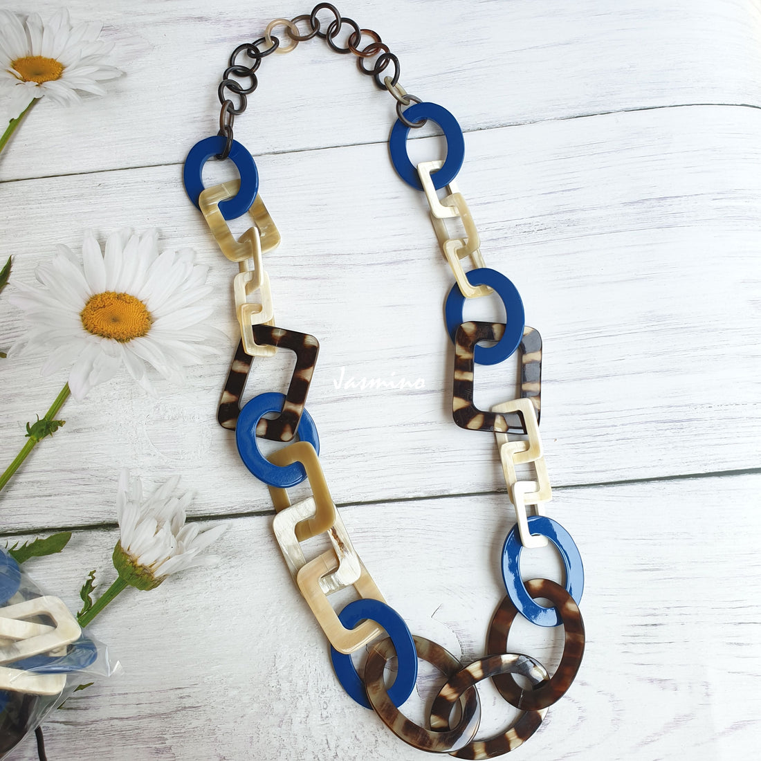 Jasmino unique handmade Bohemian and Vintage necklace is detailed by an blue and spotted brown oval and rectangle in natural buffalo horn for women
