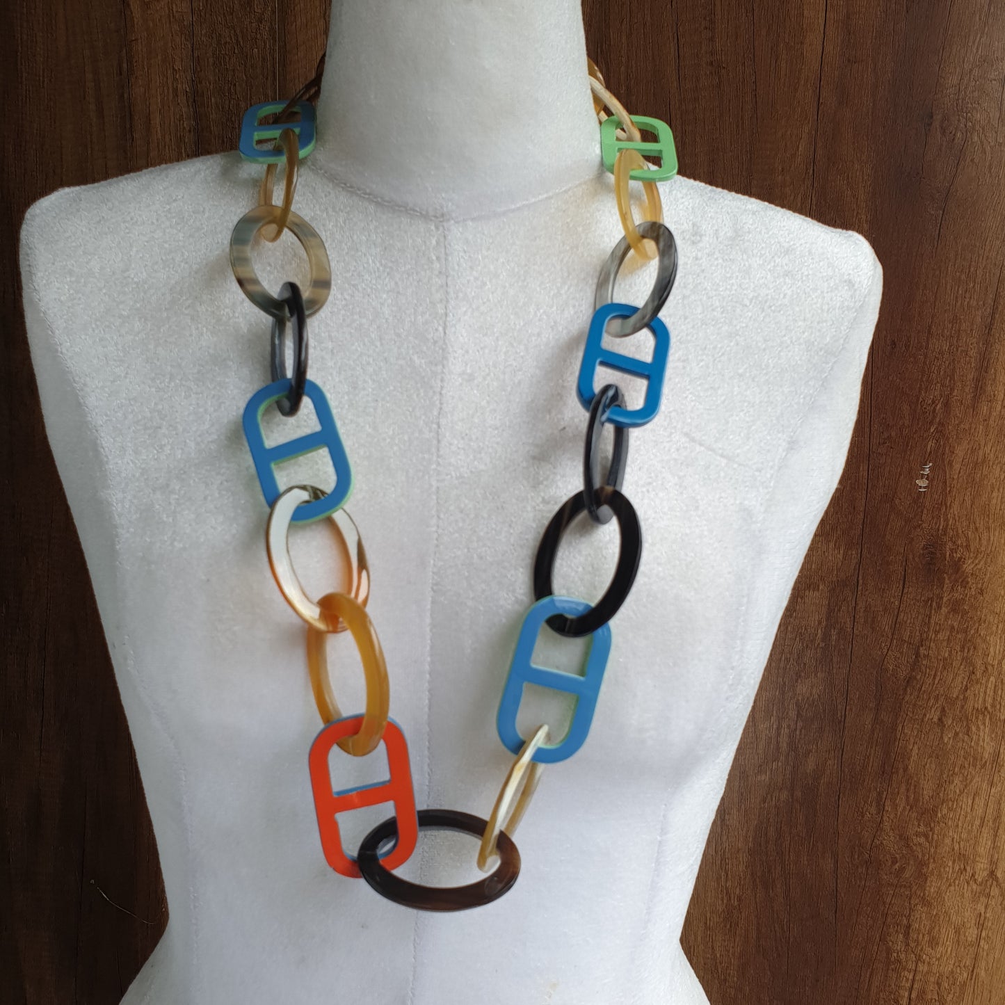 Jasmino unique handmade Vintage glasses chains feature bright colors in natural buffalo horn for women that are hang on a mannequin 