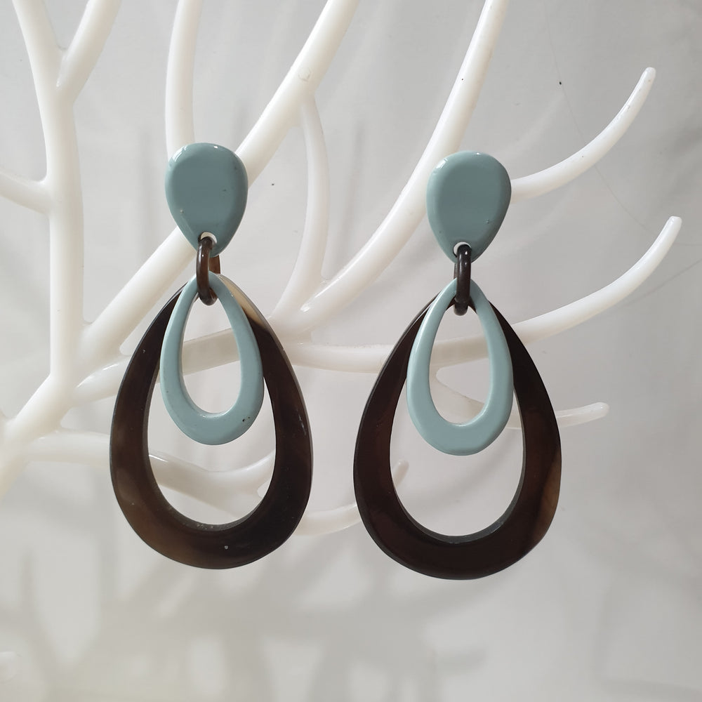 
                  
                    handmade double oval earrings feature greyish blue and black in natural buffalo horn for Spring 2023
                  
                