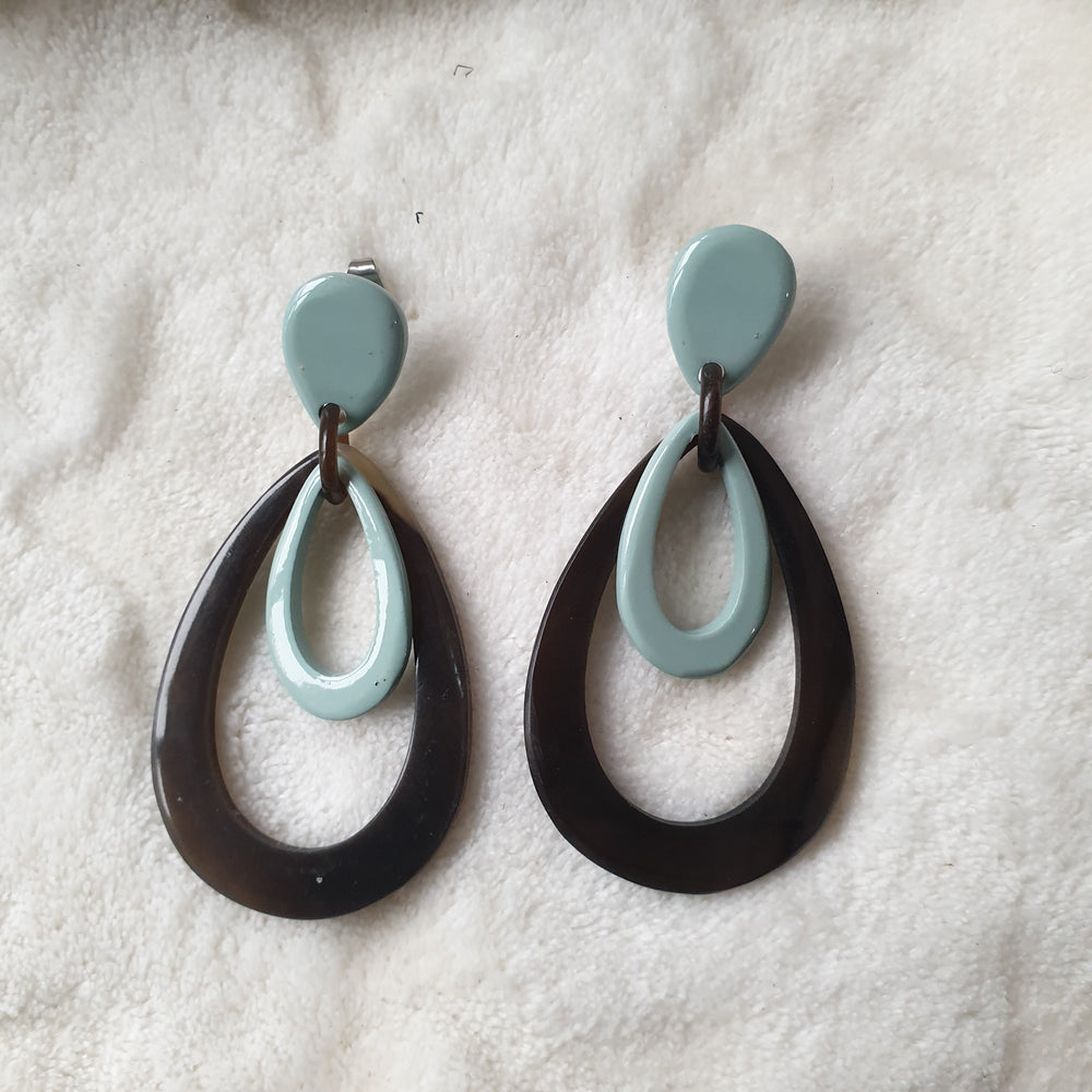 
                  
                    handmade double oval earrings feature greyish blue and black in natural buffalo horn for Spring 2023
                  
                