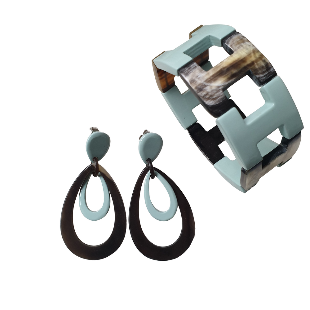 
                  
                    handmade double oval earrings and bangle bracelet feature greyish blue and black in natural buffalo horn for Spring 2023
                  
                