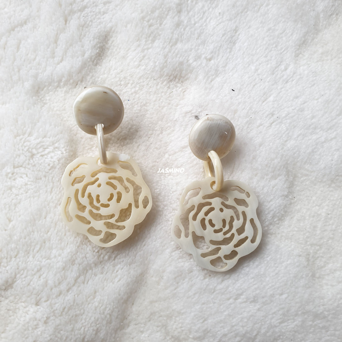 handmade drop earrings feature white and floral shape in natural buffalo horn for Spring 2023