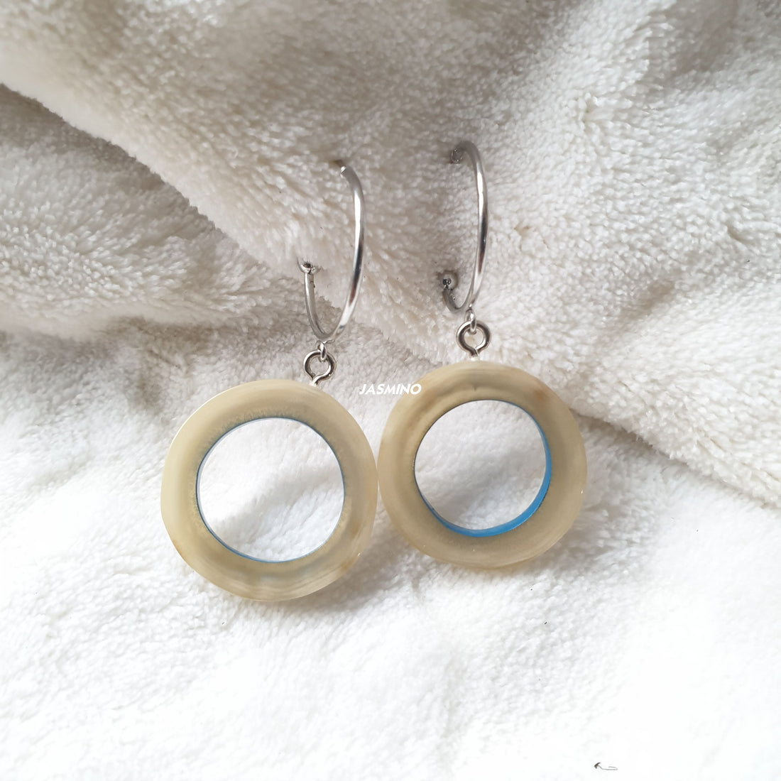 handmade bright circle hoop earrings feature blue inside in natural buffalo horn for Spring 2023