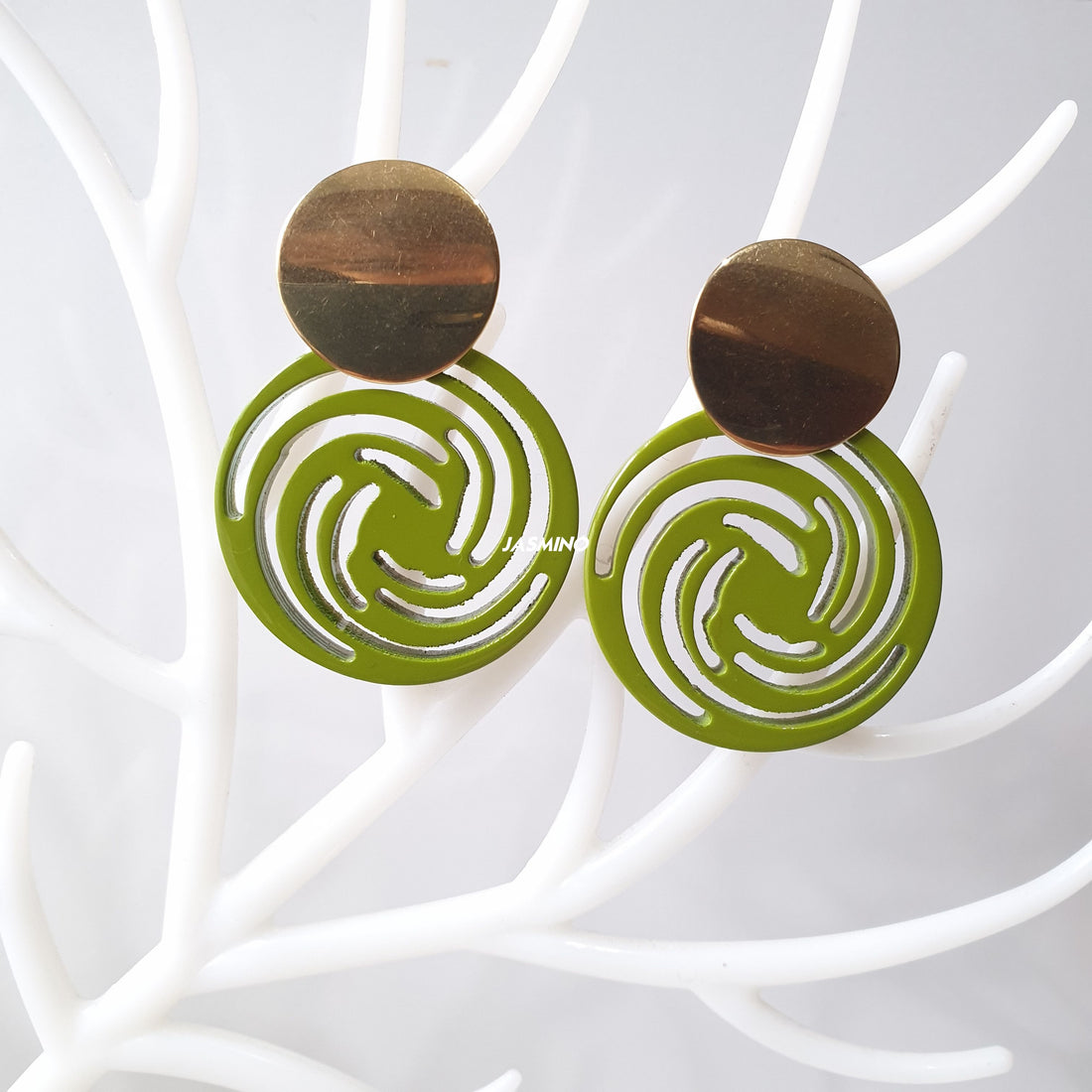 vibrant green circle drop earrings feature natural buffalo horn for Spring 2023 on faux branches