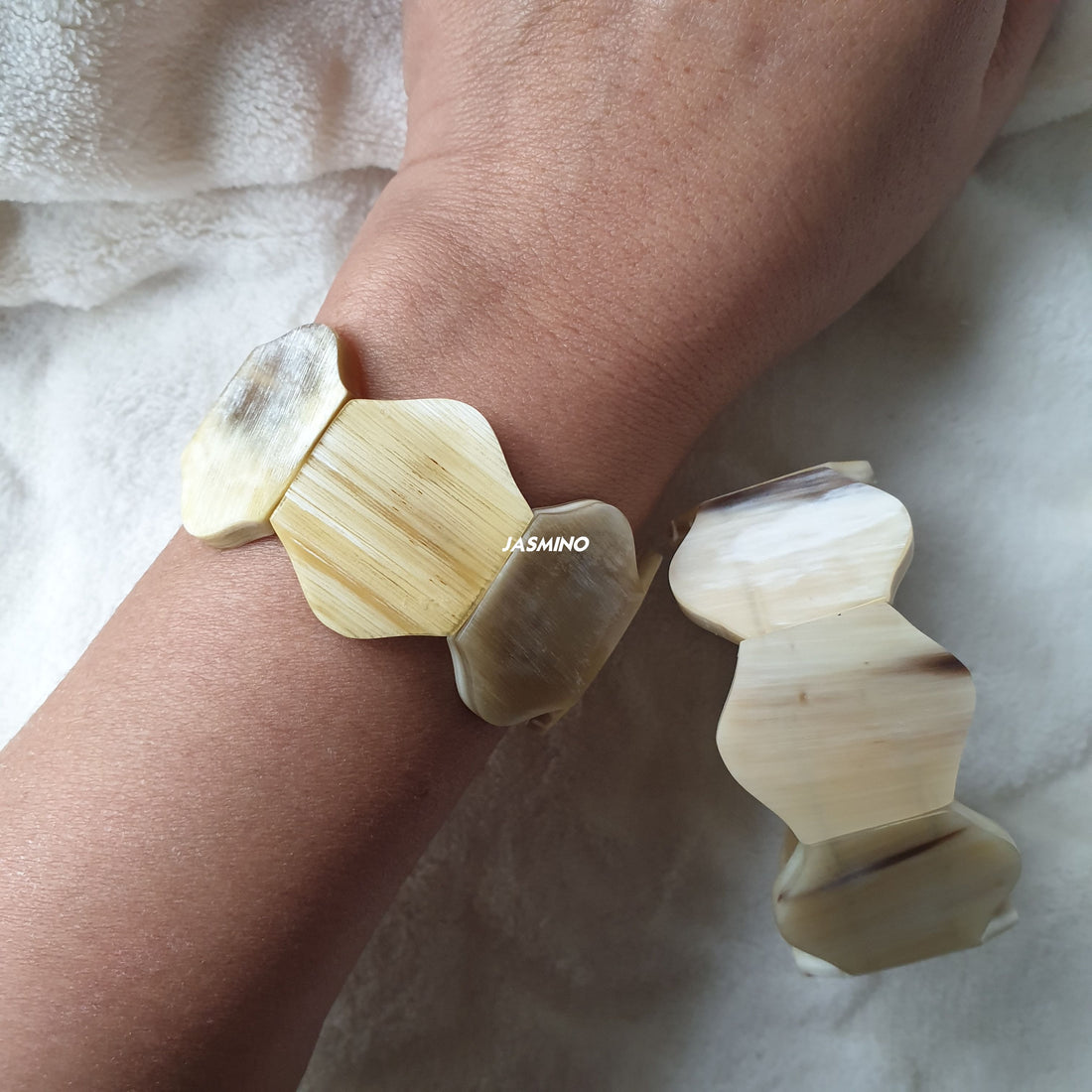 two bright geometric bangle bracelets in natural buffalo horn