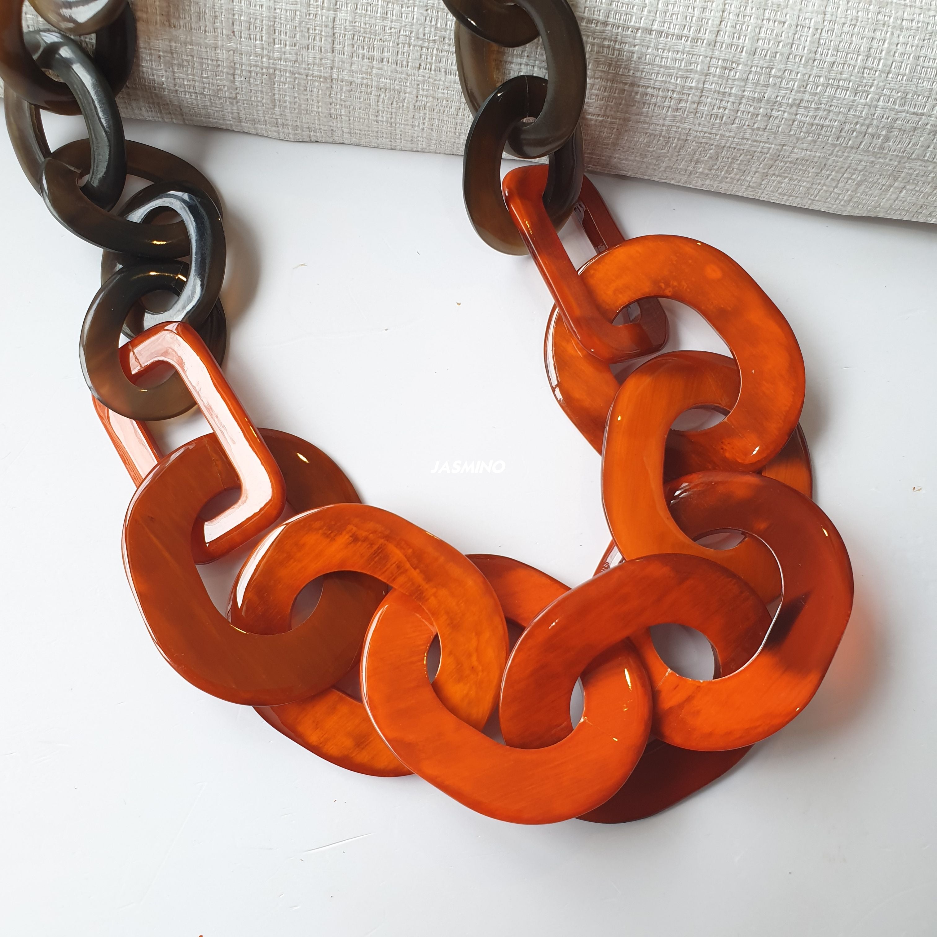 large chain link necklace features orange in natural buffalo horn for Spring 