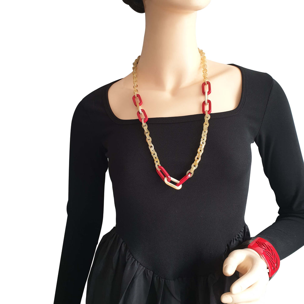 
                  
                    handmade rectangular chain link necklace features brown and red in natural buffalo horn for Spring 2023
                  
                