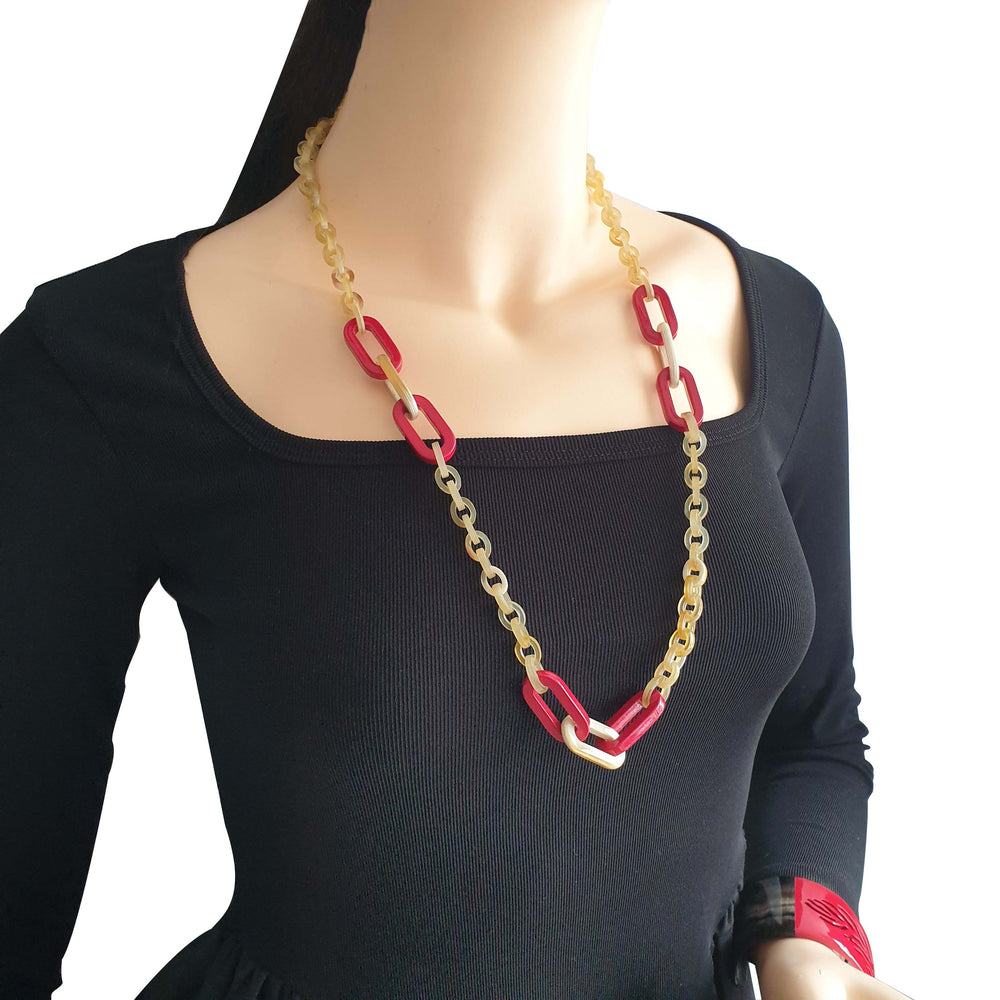 
                  
                    handmade rectangular chain link necklace features brown and red in natural buffalo horn for Spring 2023
                  
                