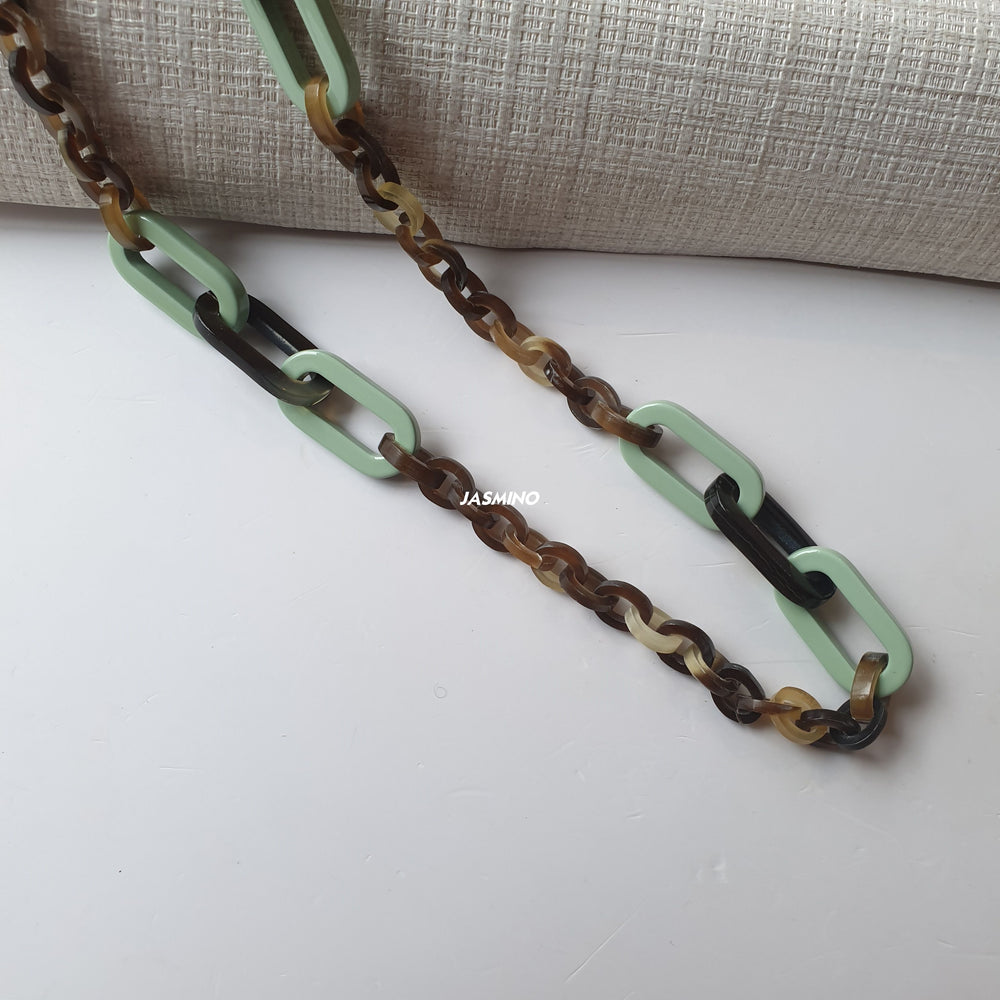 
                  
                    handmade rectangular chain link necklace features brown and cadet blue in natural buffalo horn for Spring 2023
                  
                