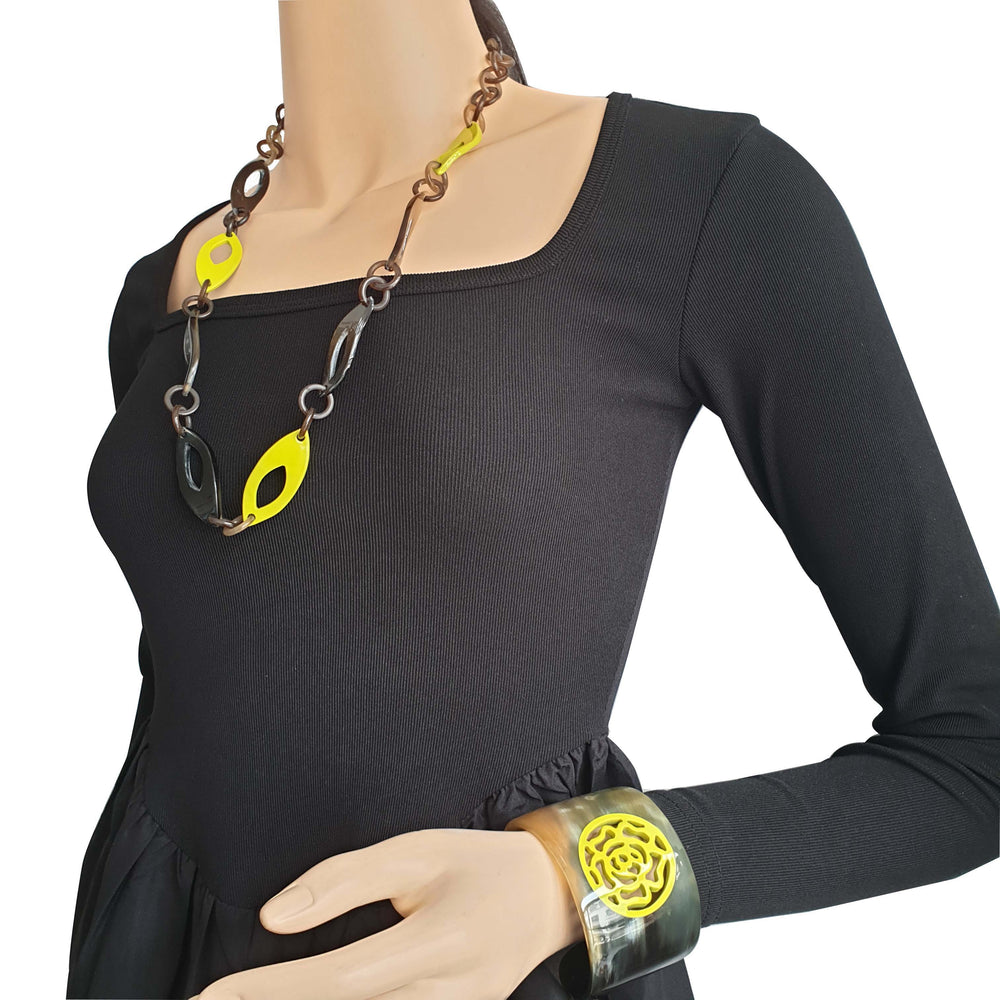 
                  
                    leaf chain necklace features yellow in natural buffalo horn
                  
                