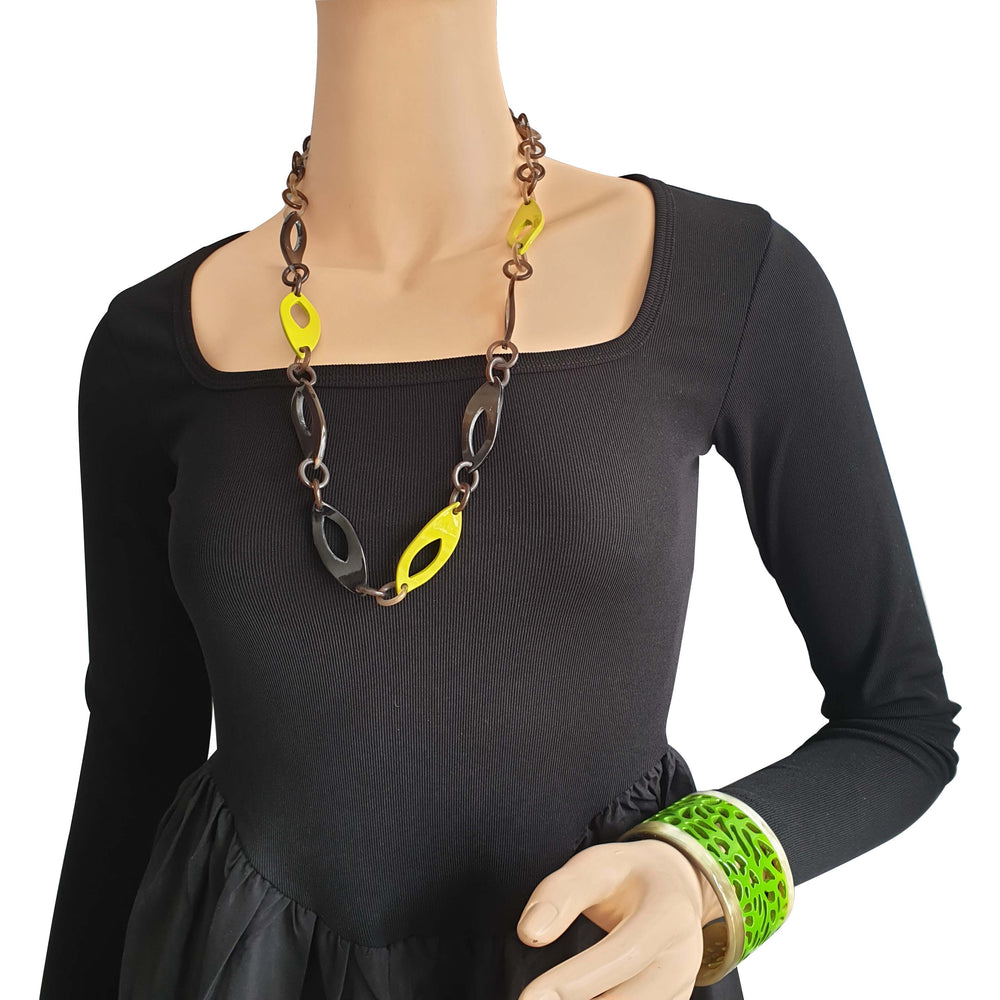 
                  
                    leaf chain necklace features yellow in natural buffalo horn
                  
                
