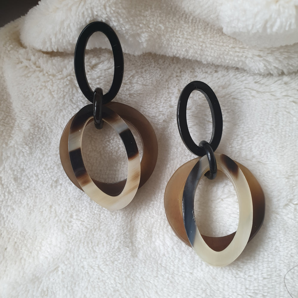 
                  
                    handmade double oval earrings feature brown and white in natural buffalo horn for Spring 2023
                  
                