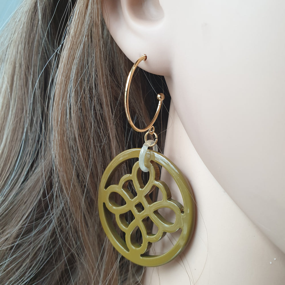 
                  
                    handmade circle hoop earrings feature taupe and floral shape in natural buffalo horn for Spring 2023
                  
                