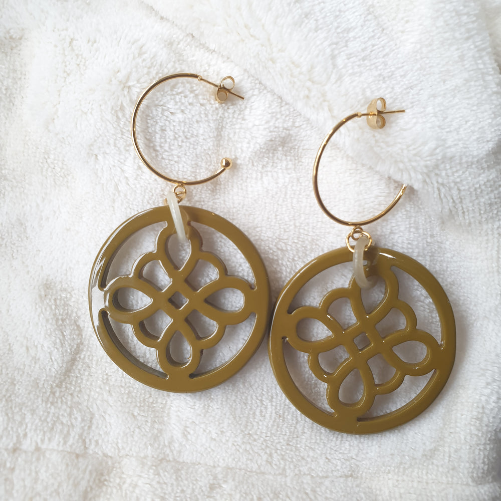 
                  
                    handmade circle hoop earrings feature taupe and floral shape in natural buffalo horn for Spring 2023
                  
                