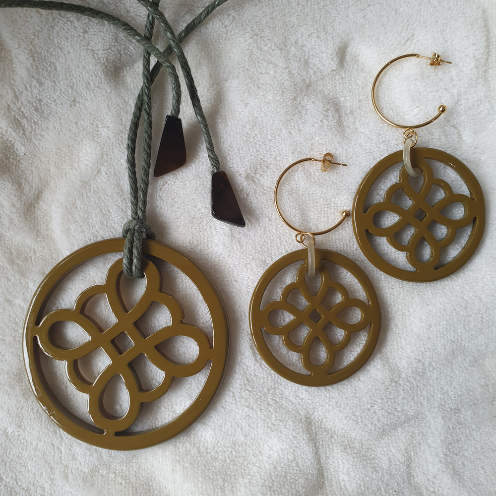 
                  
                    handmade circle hoop earrings feature taupe and floral shape in natural buffalo horn for Spring 2023
                  
                