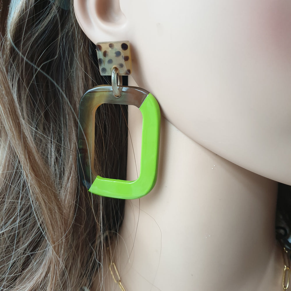 
                  
                    Handmade rectangle earrings feature leopard print and half dark and green in natural buffalo horn for Spring 2023
                  
                