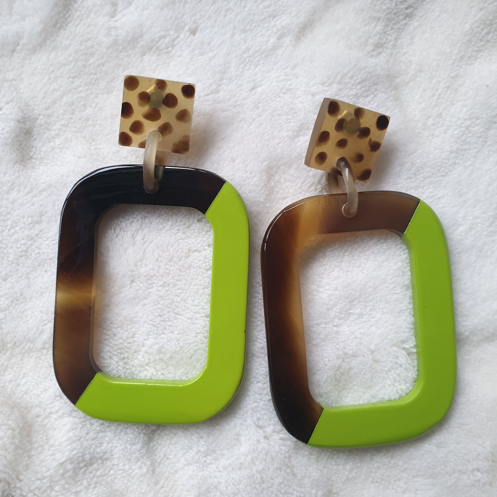 
                  
                    Handmade rectangle earrings feature leopard print and half dark and green in natural buffalo horn for Spring 2023
                  
                