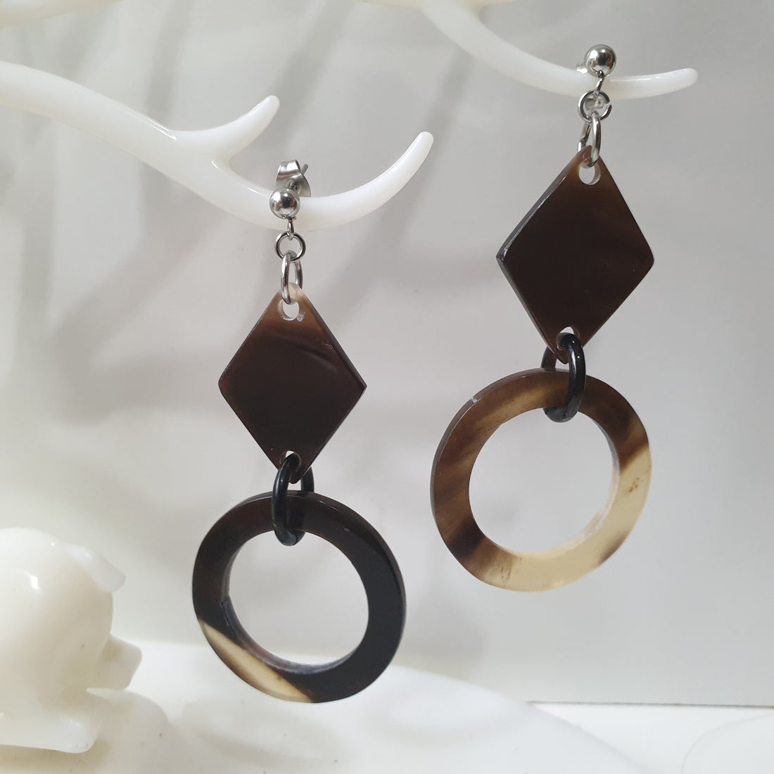 handmade earrings feature black and brown in the shape of circle and rhombus in natural buffalo horn for Spring 2023