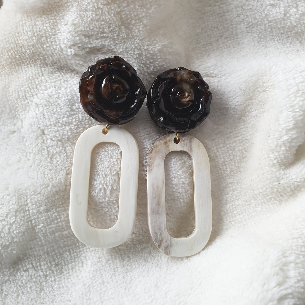 
                  
                    handmade earrings feature rose black and white rectangle in natural buffalo horn for Spring 2023
                  
                