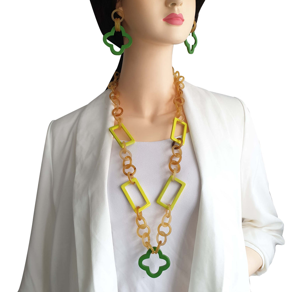 
                  
                    a model wears unique handmade green earrings 
                  
                
