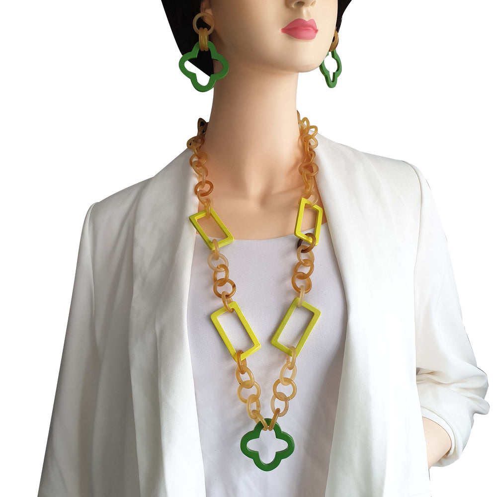
                  
                    a model wears unique handmade green earrings 
                  
                