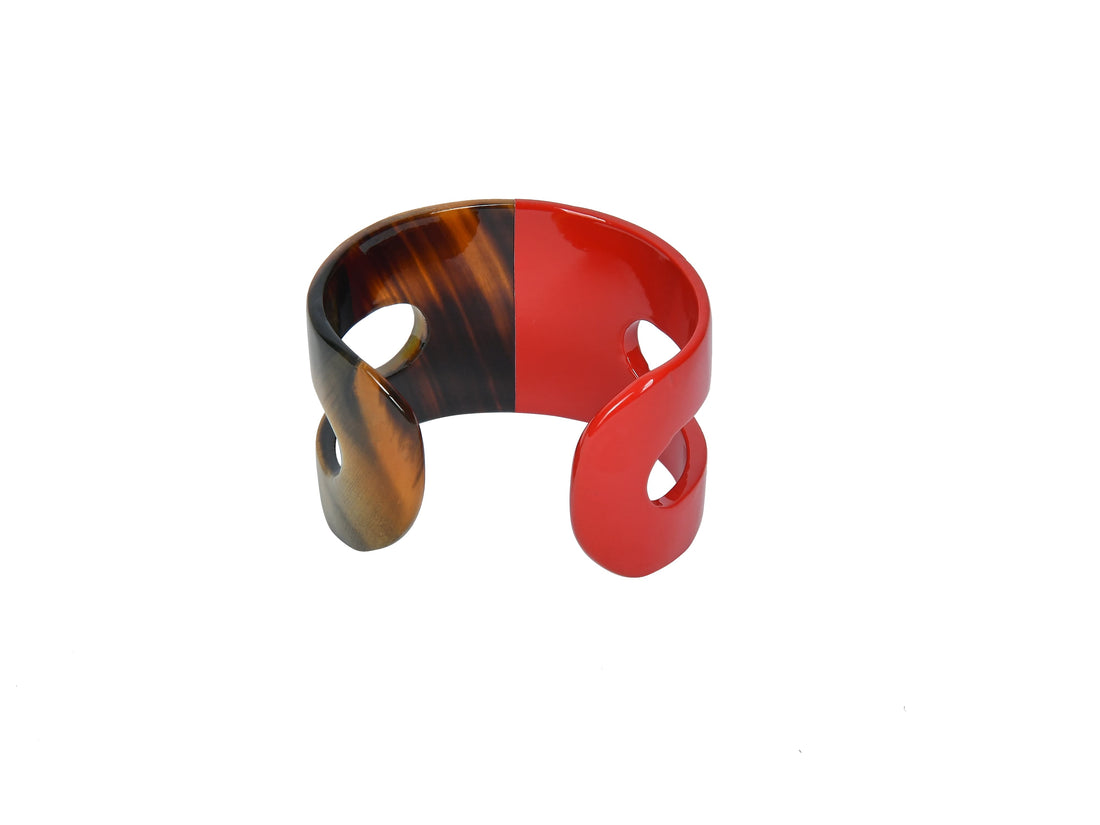 Jasmino natural buffalo horn cuff bracelet used women features a brown half and a red half in the natural light