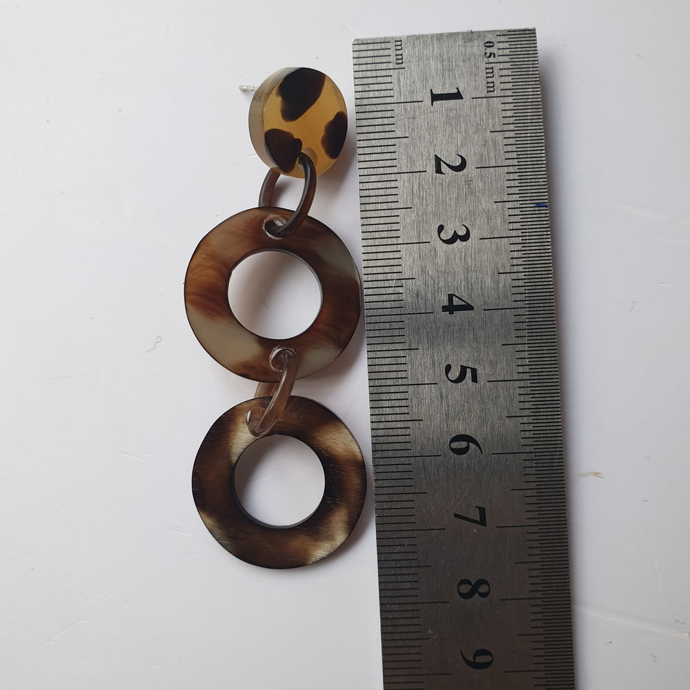 
                  
                    Bohemian Minimalist drop earrings feature spotted leopard details in natural buffalo horn for women's gifts
                  
                