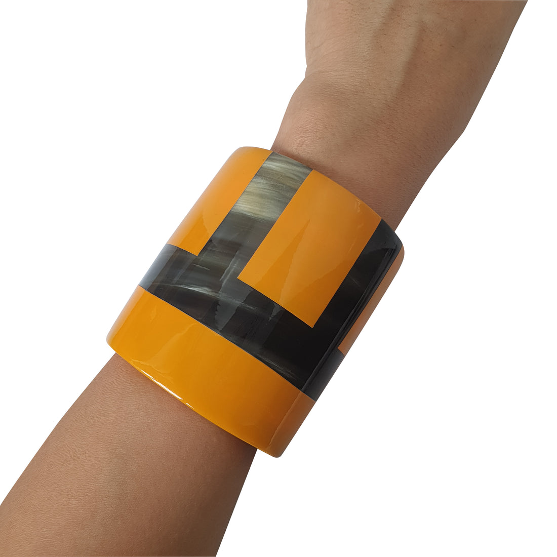 A model is wearing one of top cuff bracelets for women features yellowish brown and black on a white background