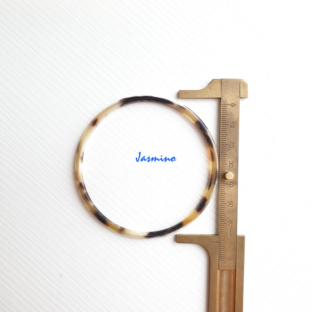 
                  
                    Jasmino unique handmade Minimalist thin bangle bracelet features spotted black in natural buffalo horn for women
                  
                